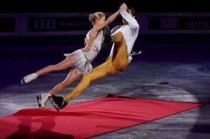 FUKUOKA, JAPAN - DECEMBER 07: Tatiana Volosozhar and Maxim Trankov of Russia fall after skating into the red carpet on their entrance for the Pairs Free Skating Final victory ceremony on day three of the ISU Grand Prix of Figure Skating Final 2013/2014 at Marine Messe Fukuoka on December 7, 2013 in Fukuoka, Japan. (Photo by Chris McGrath/Getty Images) Copyright Â© 2013 Getty Images. All rights reserved.